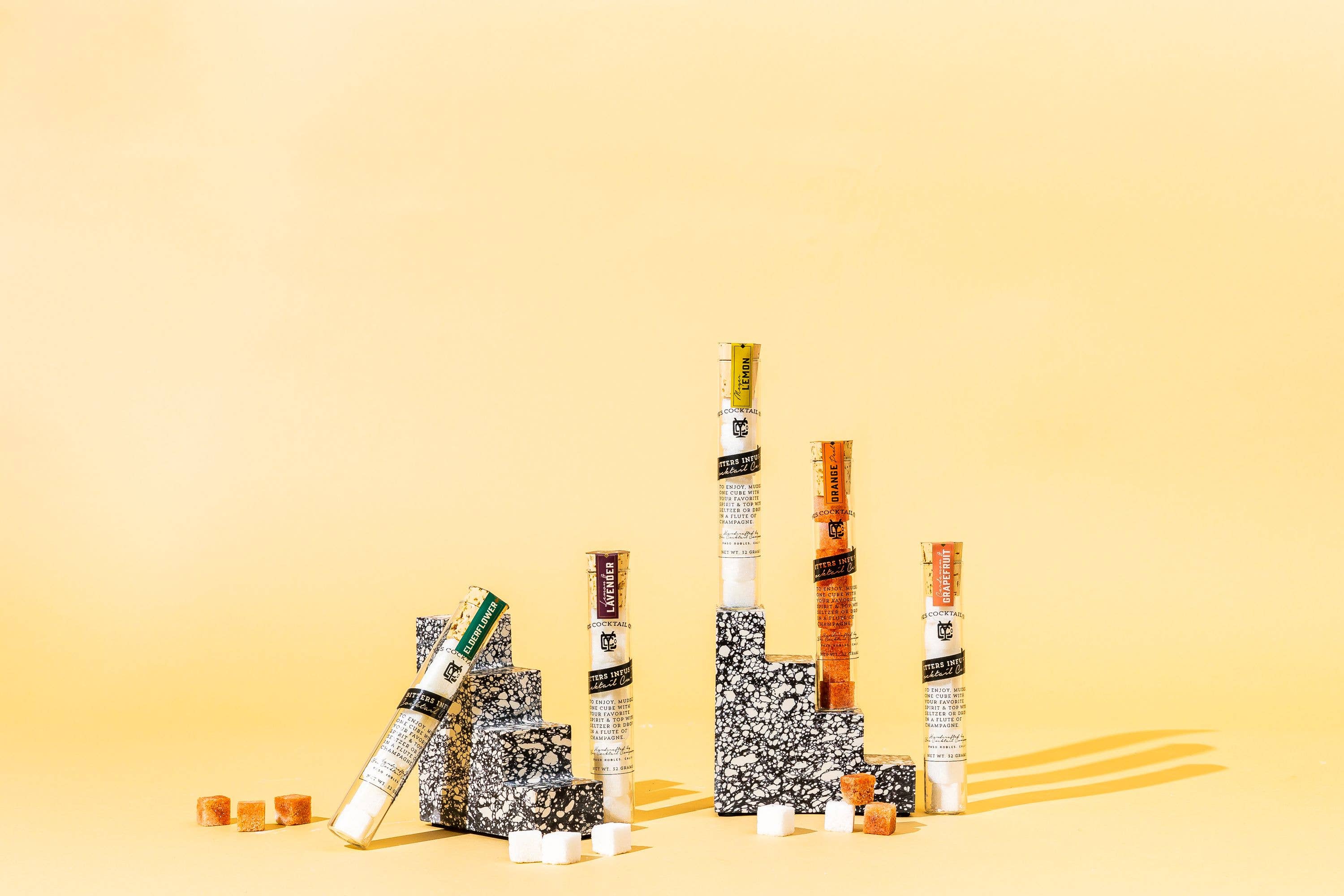 Stacked sugar cube tubes on a yellow background