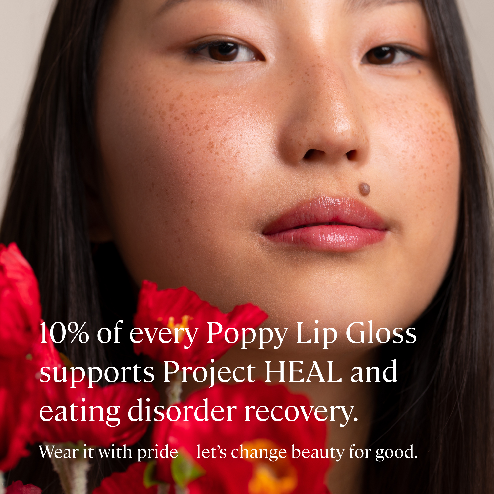 Close-up of a woman's face with red flowers and text about Project HEAL and eating disorder recovery.