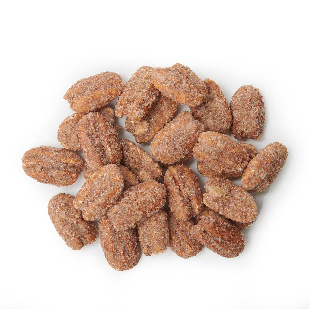 Pecans coated with a brown sugar mixture on a white background
