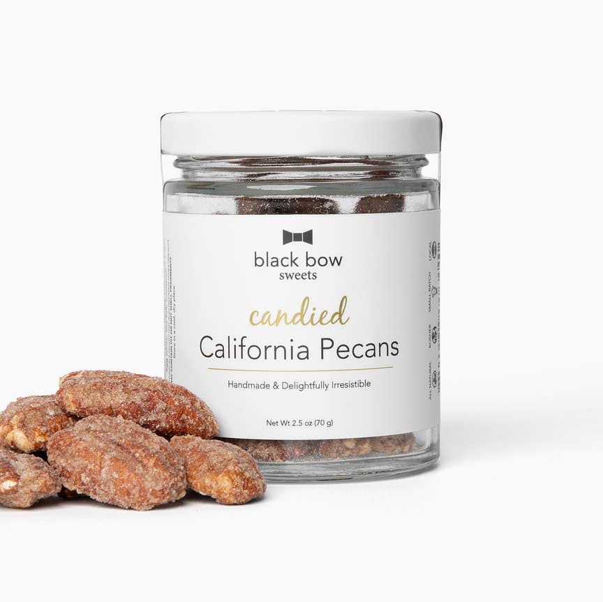 Jar of candied California pecans with a label on a white background