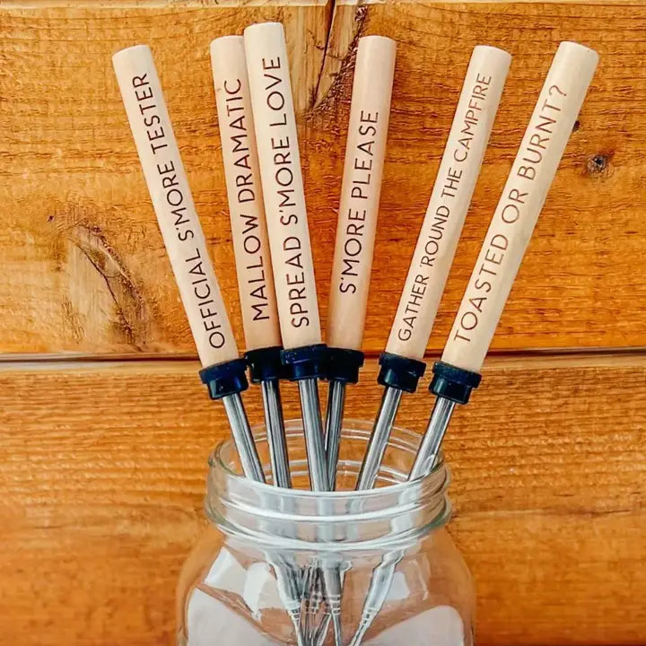 Set of wooden sticks with text in a glass jar on a wooden background