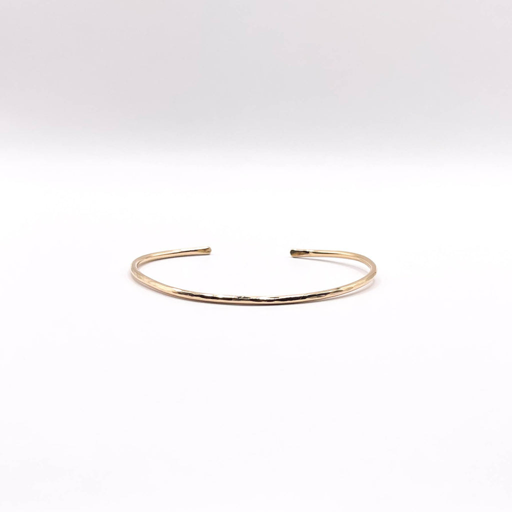 Gold bracelet on a white background