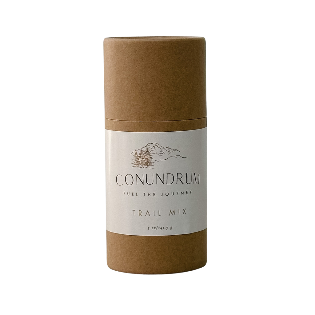 Kraft paper tube with 'Conundrum' trail mix label on a white background